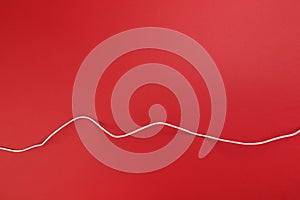 White power cable socket on red background