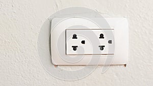 White power socket on cement wall