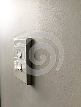 White power switch board on white wall