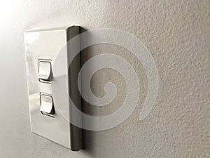 White power switch board on white wall