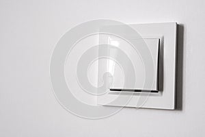 White power switch on white wall