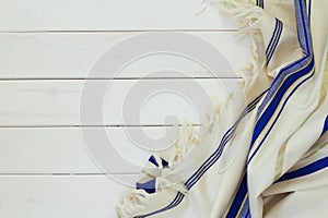 White Prayer Shawl - Tallit, jewish religious symbol. photo