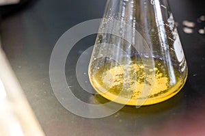 white precipitate in yellow solution