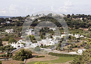 White prehistoric trulli roundhouses in Itria Valley, south-east Murgia.