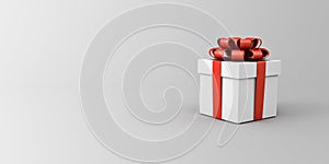 White present box with red ribbon and bow or white gift box on grey background with blank gradient space minimal concept