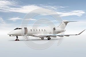 White private jet with an opened gangway door isolated on bright background with sky