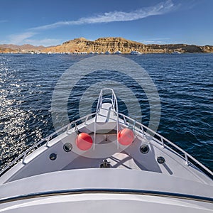 White private yachts in Red sea harbor. Tourist yacht boat goes to port near mountains. Egypt Sharm El Sheikh