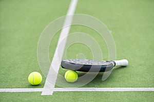 White professional paddle tennis racket with natural lighting on blue background. Horizontal sport theme poster