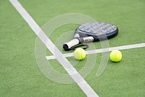 White professional paddle tennis racket with natural lighting on blue background. Horizontal sport theme poster