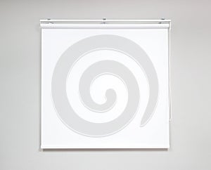 White projector screen for showing information or cinema in office room