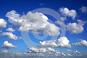 White puffy clouds in blue sky