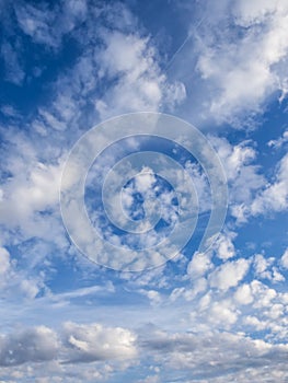 White, puffy clouds in blue sky