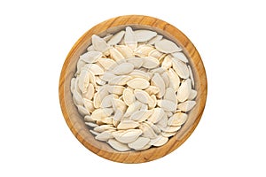 White pumpkin seeds in a plate, top view. Isolated on white background