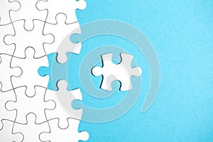 White puzzle with missing part