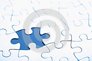 White puzzle with missing part