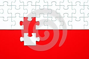 White puzzle pieces on a red background separated