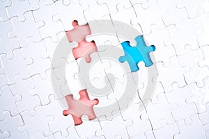 White Puzzle pieces with three piece removed, blue and pink color