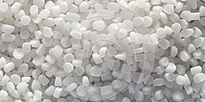 White PVC granulate background, recycled plastic granules, biodegradable plastic. Granules of eco-friendly plastic raw