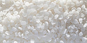 White PVC granulate background, recycled plastic granules, biodegradable plastic. Granules of eco-friendly plastic raw