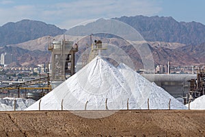 White pyramids with natural sea salt, salt works on factory near