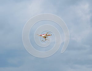 White quadcopter in the sky