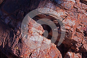 WHITE QUARZITE VEIN IN SLANTED RUST COLOURED ROCK