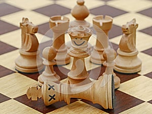 White queen kills white king on chess game, chess crime scene, concept of treachery