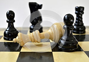 The white queen was defeated by two pawns  on chess board