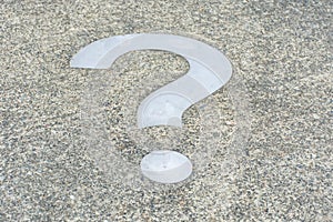 White Question mark on concrete concept - decisions, uncertainty, choice in life or business. Copy space