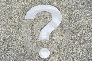 White Question mark on concrete concept - decisions, uncertainty, choice in life or business. Copy space