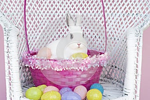 White Rabbit in Easter Basket with Easter Eggs