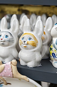 White rabbit figurines in Easter fair store