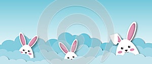 White rabbits with clouds on blue sky background, Holiday illustration for greeting card of Easterâ€™s Day.