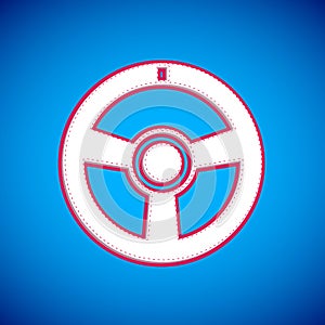 White Racing steering wheel icon isolated on blue background. Car wheel icon. Vector