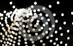 White radial bokeh background. Lightbulbs at night. Street decor. Christmas lights, holiday concept