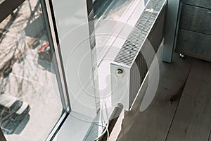 White radiator battery in the office near the window