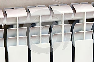 White radiator. Close up elements modern battery - source of heat