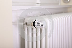 White radiator with white thermostat