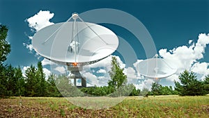 White Radio Telescope, a large satellite dish on a background of blue sky, radar. Technology concept, search for extraterrestrial