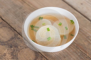 White radish soup in white bowl.