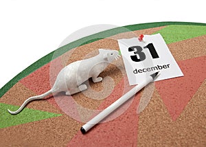 A white rat next to a torn calendar sheet on December 31 and a pen on a cork Board.