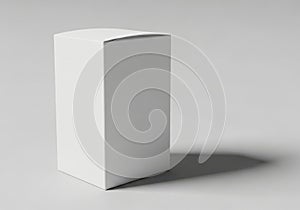 A white rectangular box standing upright on a flat surface with a shadow