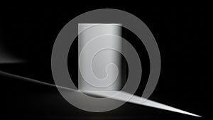 White Rectangular Object in Dark Room with Light Beam