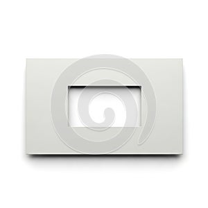A white rectangular object with a square cutout in the center