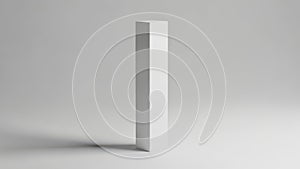 A white rectangular object standing upright on a plain surface