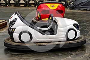 White and red bumper cars at the amusement park