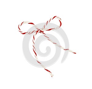 White and red Christmas wrapping rope tied in a bow isolated on white