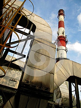 White and red concrete chimney and part of dedusting system