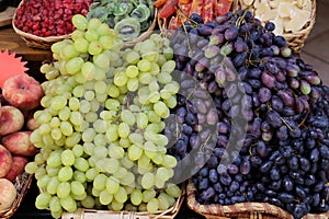 White and red grapes in a market stall