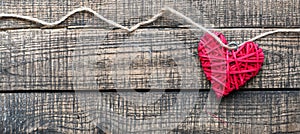 White and red heart on a wooden background